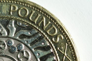 "British two pound coin (crop)" by alf.melin is licensed under CC BY-SA 2.0.